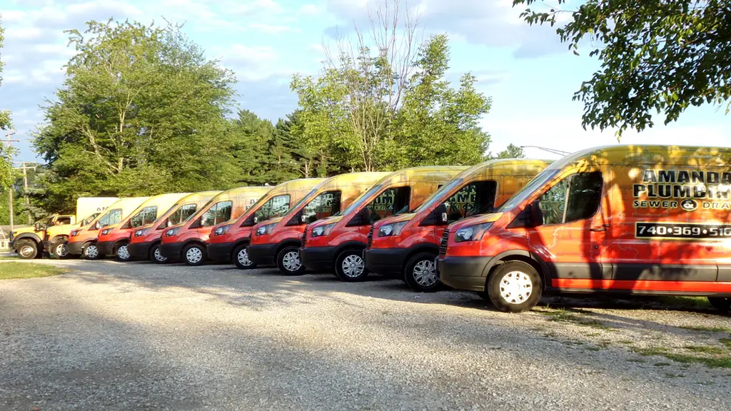 Amanda Plumbing service vans lined up at the Delaware, Ohio shop